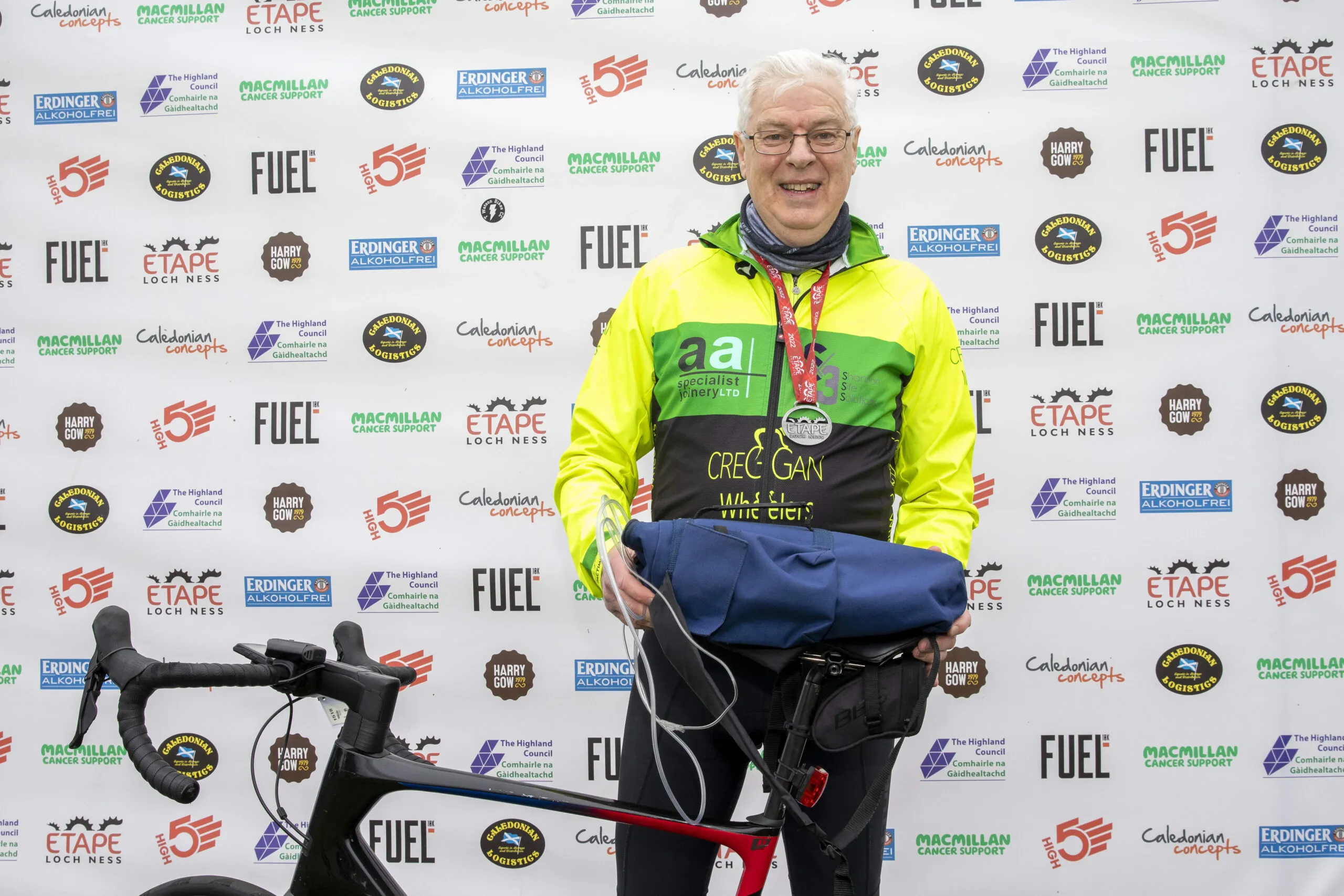 Long Covid sufferer in Northern Ireland completes 66-mile cycle sportive in Scotland with oxygen cylinders on his back